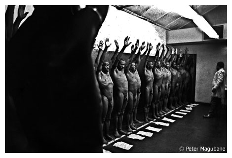 Wenela recruiting corporation, Eloff St Extension, Johannesburg, 1959. For chest examinations the recruits were required to strip. Magubane gained access to the facility by wearing a white coat and posing as an official. COPYRIGHT: PETER MAGUBANE