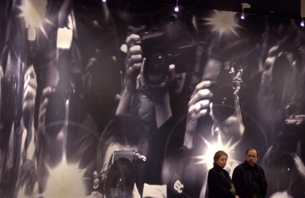 Deb and Vince Atencio, of Denver, wait to enter one of seven free films offered Saturday, May 18, 2002, in honor of the grand opening of the Madstone art cinema complex in Denver. Combined with the Denver Film Society's new Starz Encore Film Center and a chain of art cinemas scattered through the city's venerable old movie houses, Denver now boasts a significant number of foreign and art film screens.