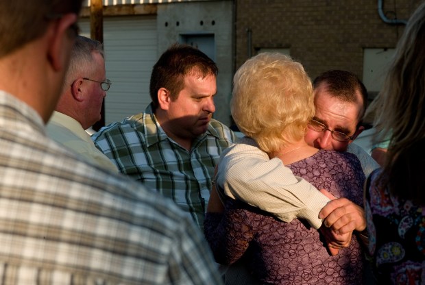 Miner Bodie Allred, right, cousin of missing miner Kerry Allred, embraces a friend at the memorial viewing in Price, Utah, for Dale Ray Black, one of the rescuers killed trying to free Kerry Allred and five others n the nearby Crandall Canyon mine. © Kevin Moloney, 2007
